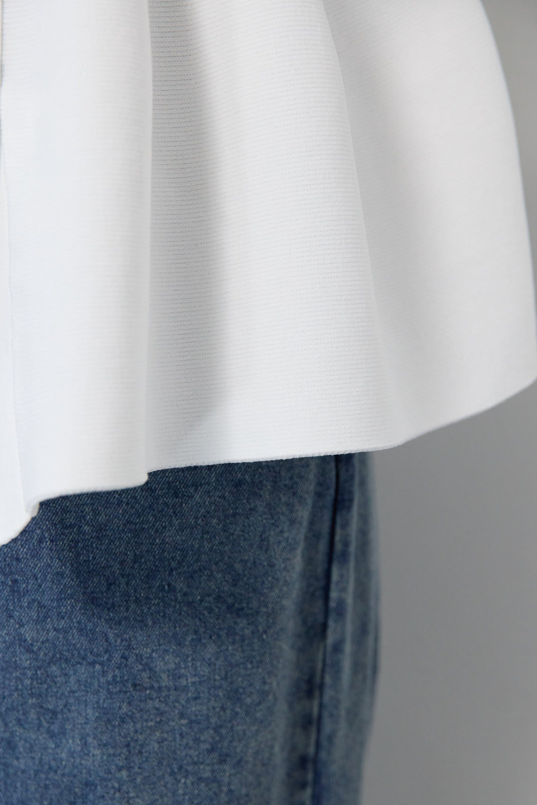 ニュアンス釦ペプラムニットカーディガン