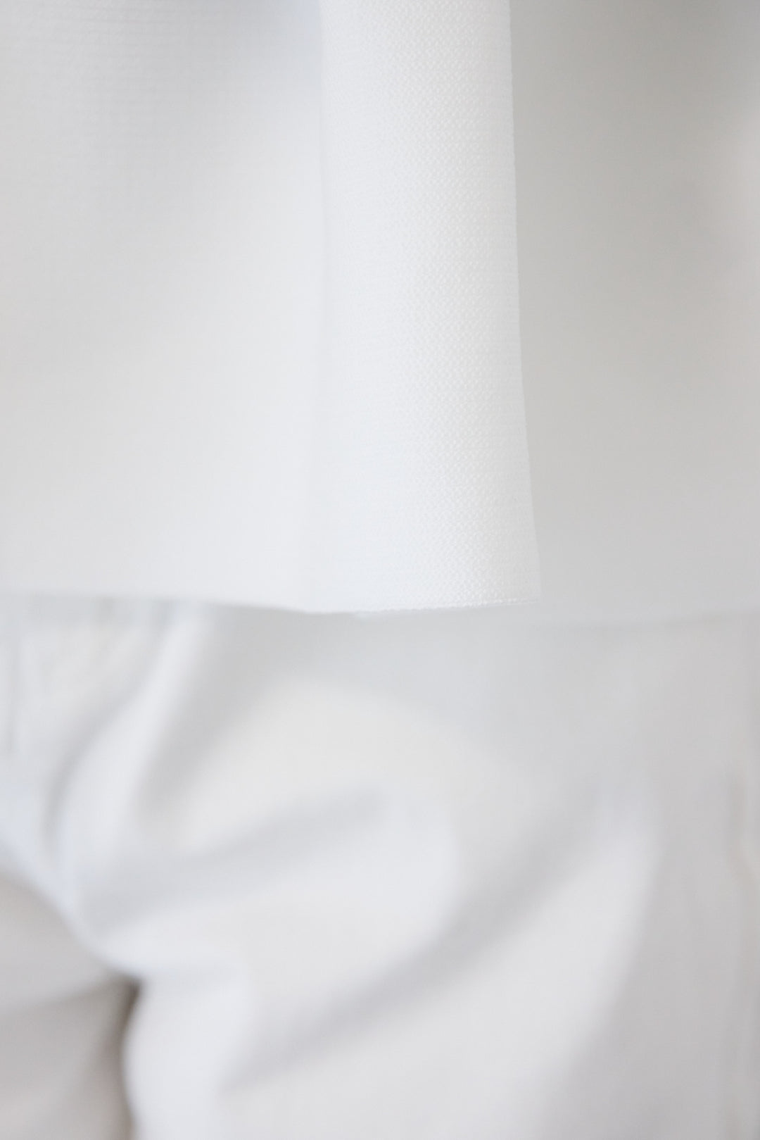 クルーネックペプラムニット